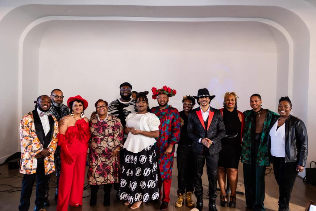 photo from a mashup group brunch event, 12 people dressed up with the theme of "roses of resilience" 