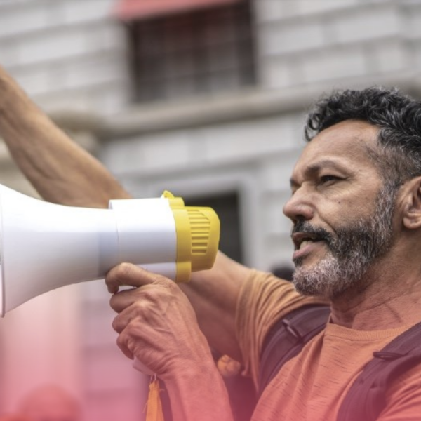 Photo of man with raised fist and megaphone